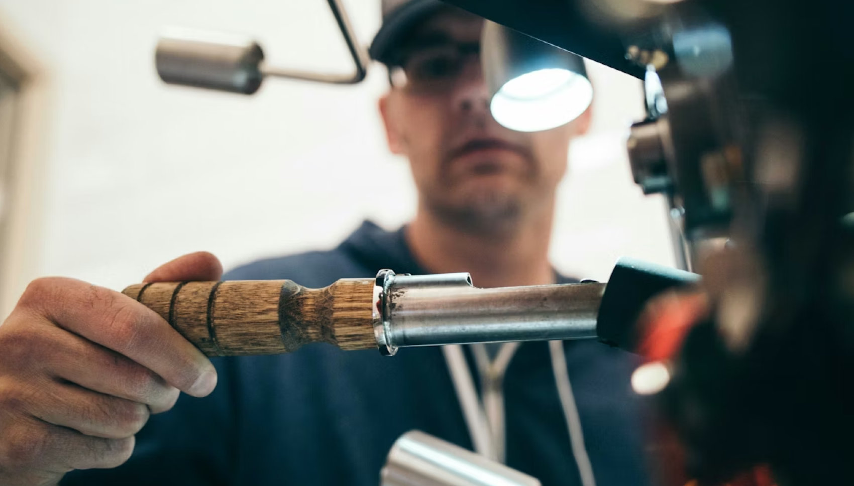 A tradesperson at work with a soldering torch